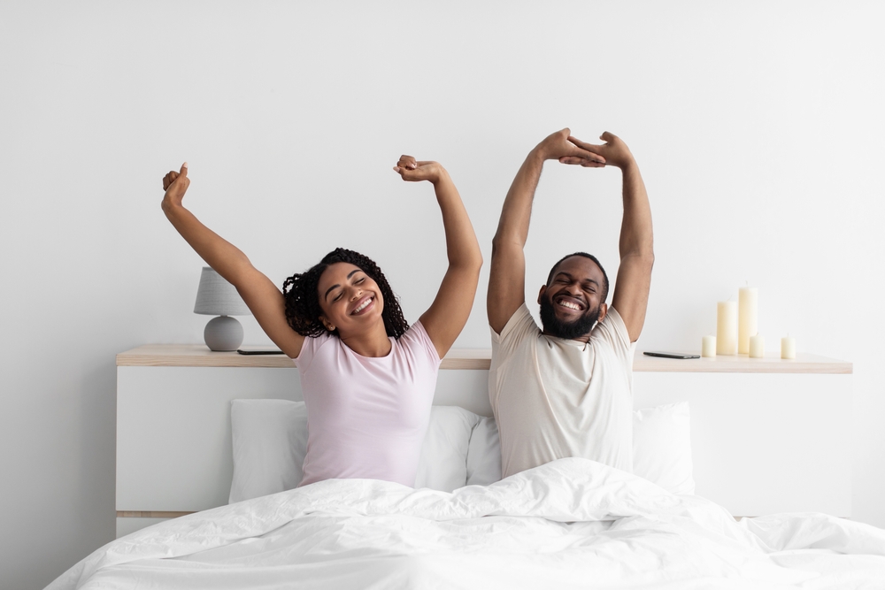 Happy Couple waking up well rested